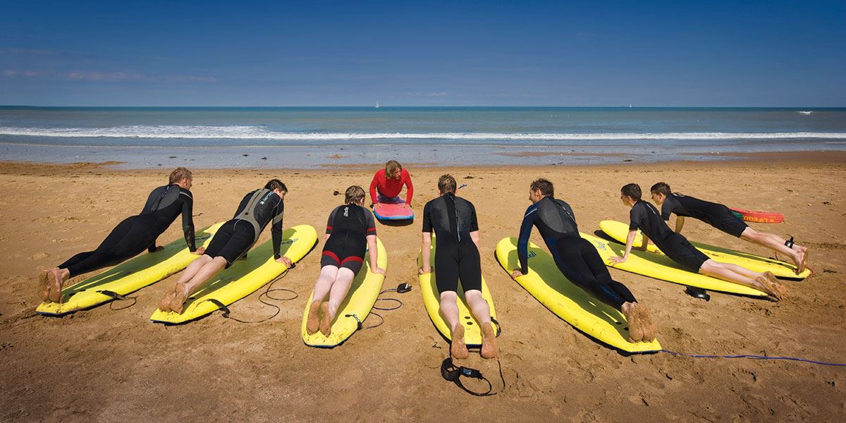 here's lots of opportunities to try out surfing while you're here