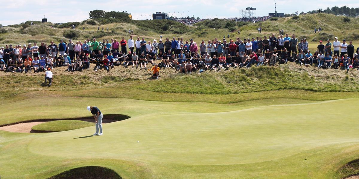 Pro golfer Tommy Fleetwood putting at Royal Birkdale