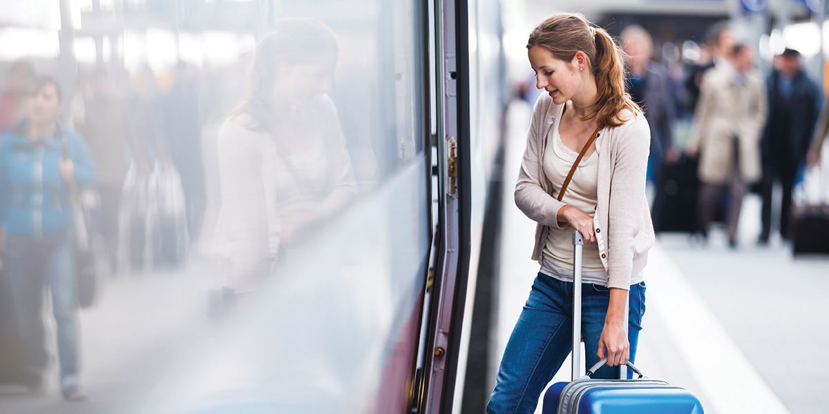 Woman getting onto train Inverness and Loch Ness travel