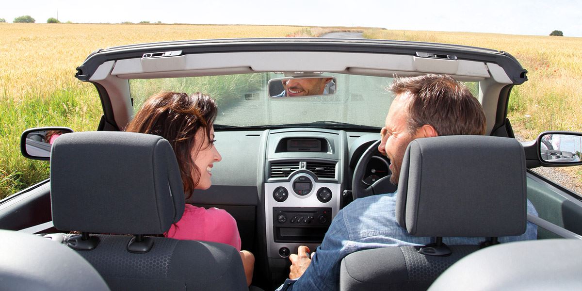 Couple in open-top car