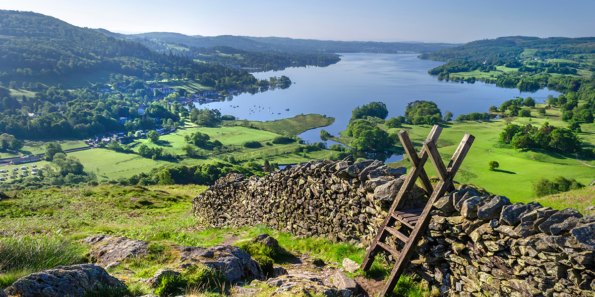 A morning shot of Lake Windermere showing stone walling