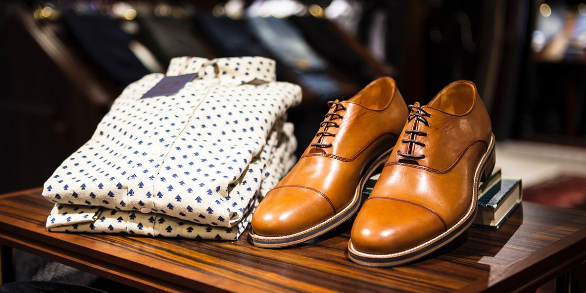 Smart shirt and shoes at menswear shop