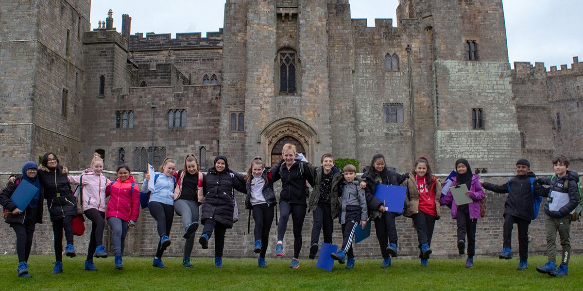 Schoolchildren show off their new boots, courtesy of The Big Smile and the Walk & Talk Trust, at Raby Castle
