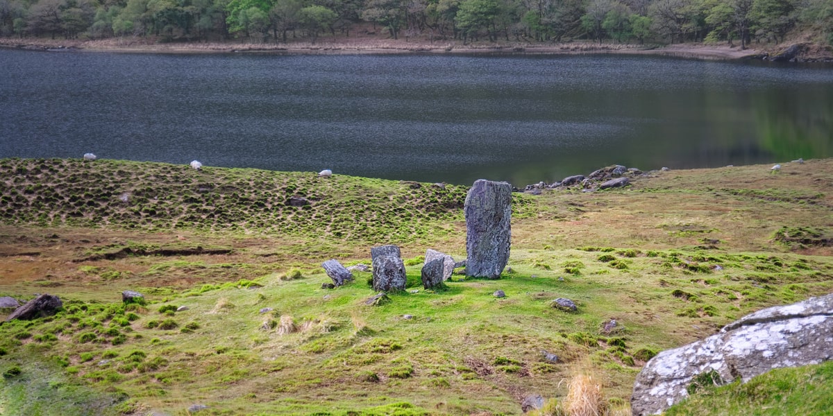 The Uragh Stone Circle is an axial five-stone circle located near Gleninchaquin Park, County Kerry, Ireland. The Bronze Age site includes a multiple stone circle and some boulder burials.