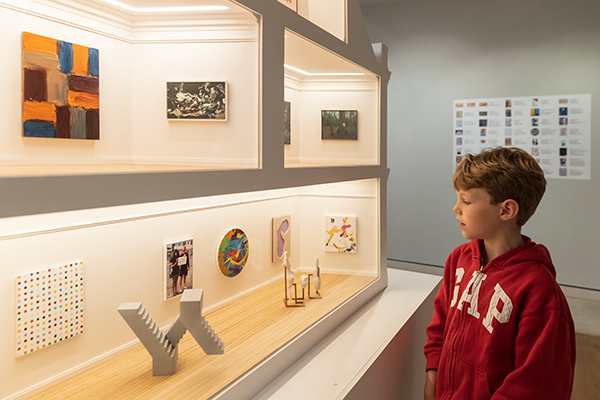 Picture of child looking at pieces of art in Pallant House Gallery